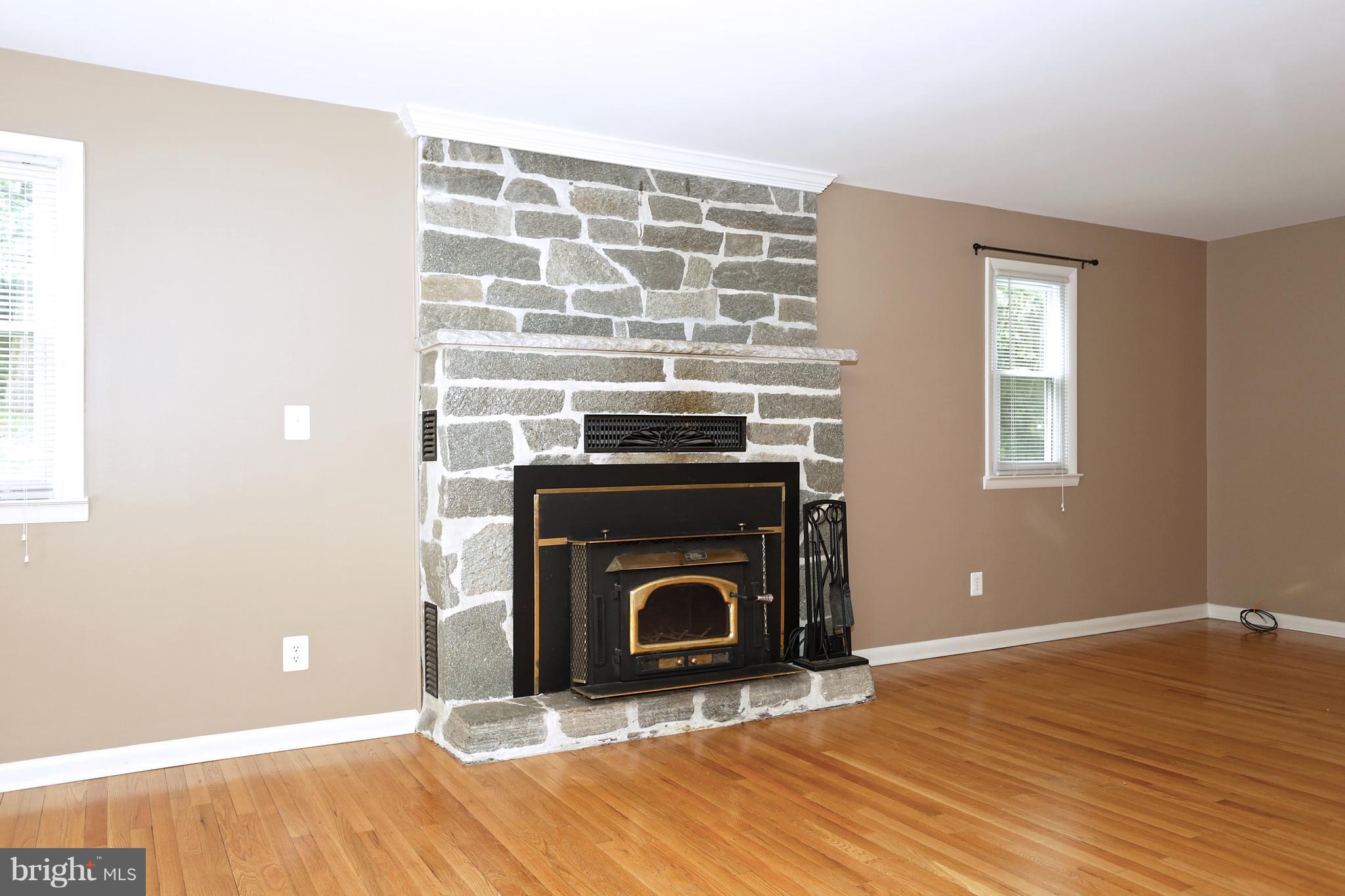1213 Watervale Road Fallston, MD 21047 - Photo 10 of 30 a view of an empty room with wooden floor fireplace and a window