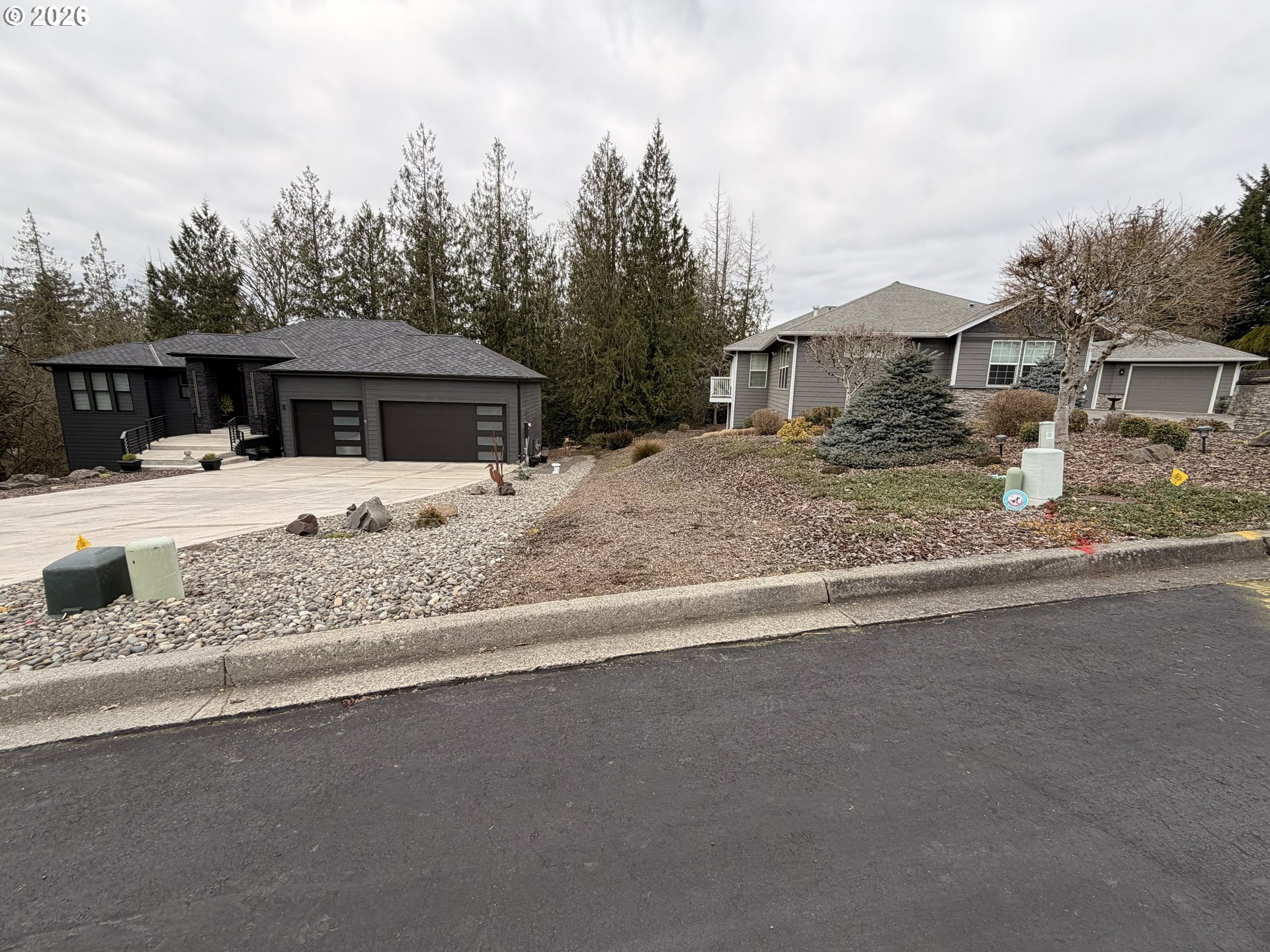 4 Forest Hill Estate Longview, WA 98632 - Photo 5 of 12 a white house that has a tree in front of it