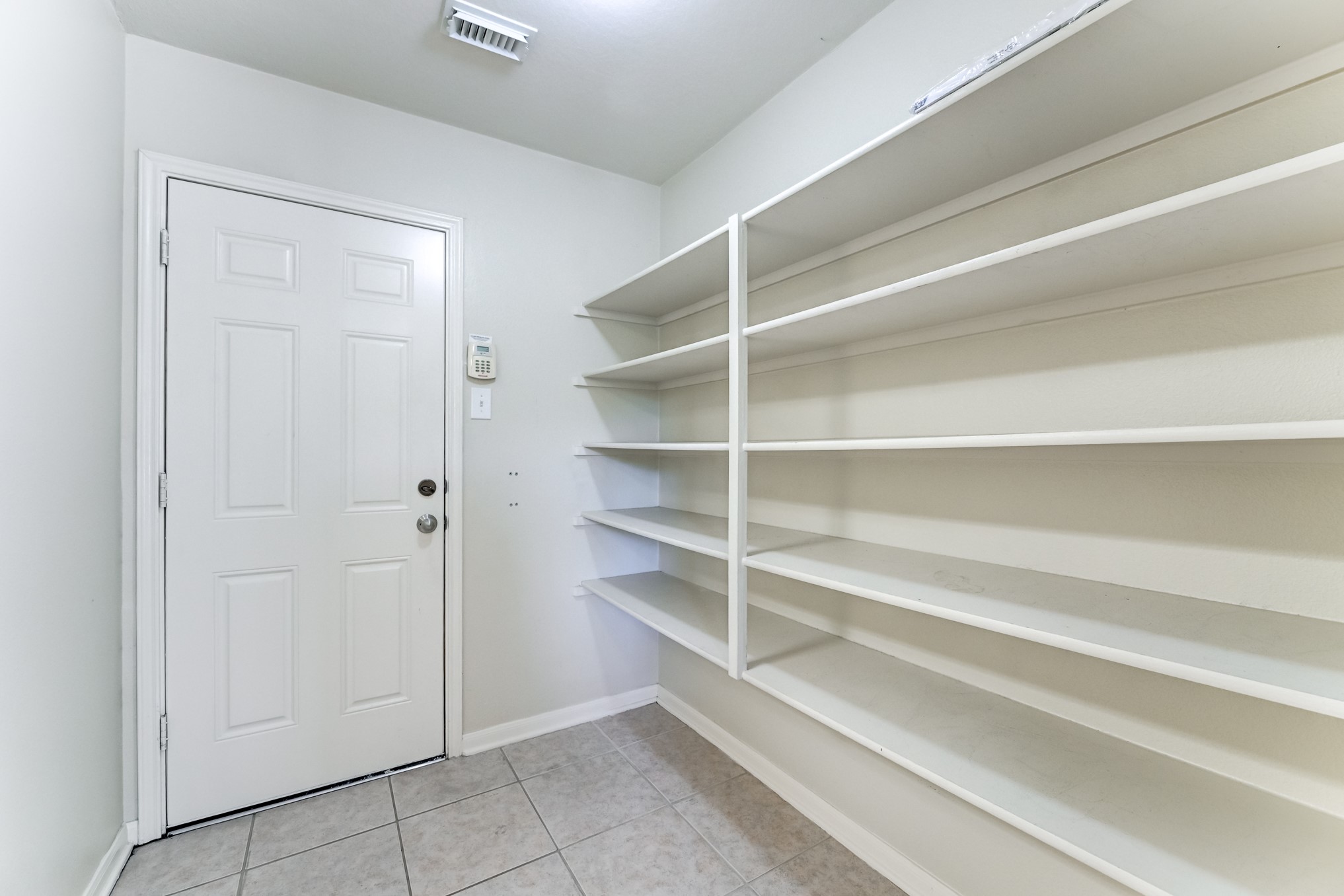 14914 Forest Enclave Lane Houston, TX 77068 - Photo 20 of 49 a view of an empty walk in closet