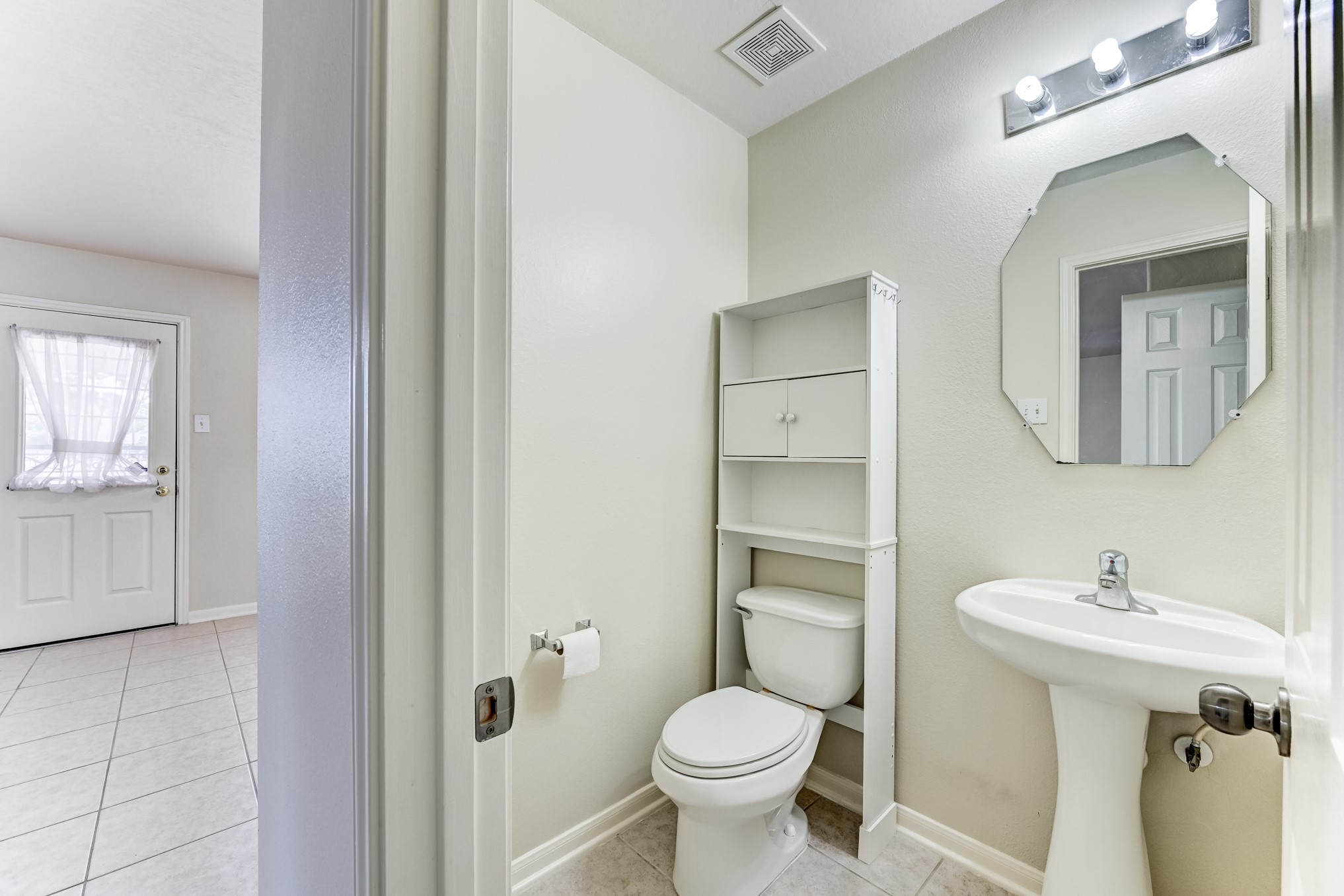 14914 Forest Enclave Lane Houston, TX 77068 - Photo 21 of 49 a bathroom with a toilet sink and mirror