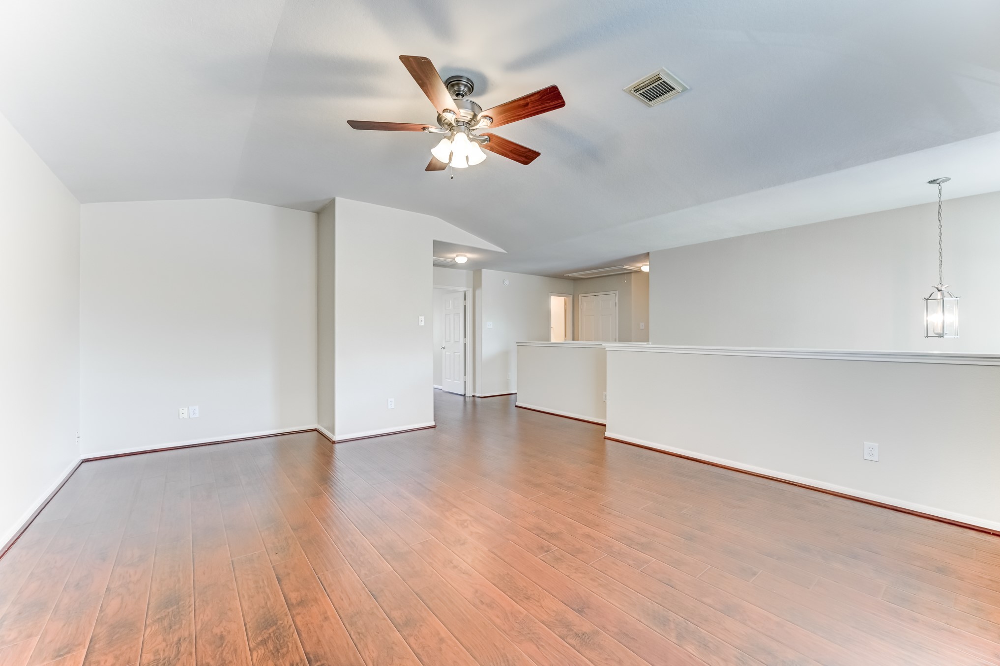 14914 Forest Enclave Lane Houston, TX 77068 - Photo 23 of 49 a view of an empty room with wooden floor