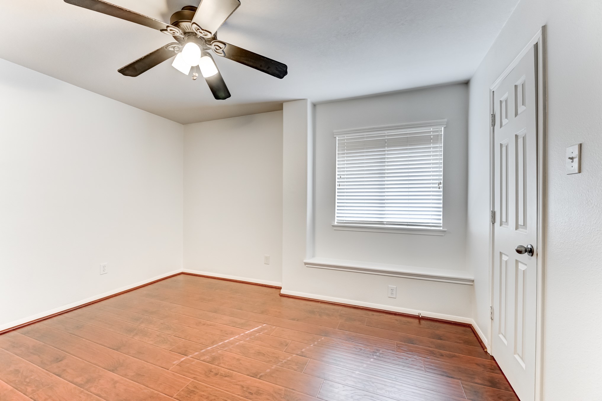 14914 Forest Enclave Lane Houston, TX 77068 - Photo 39 of 49 wooden floor in an empty room with a window