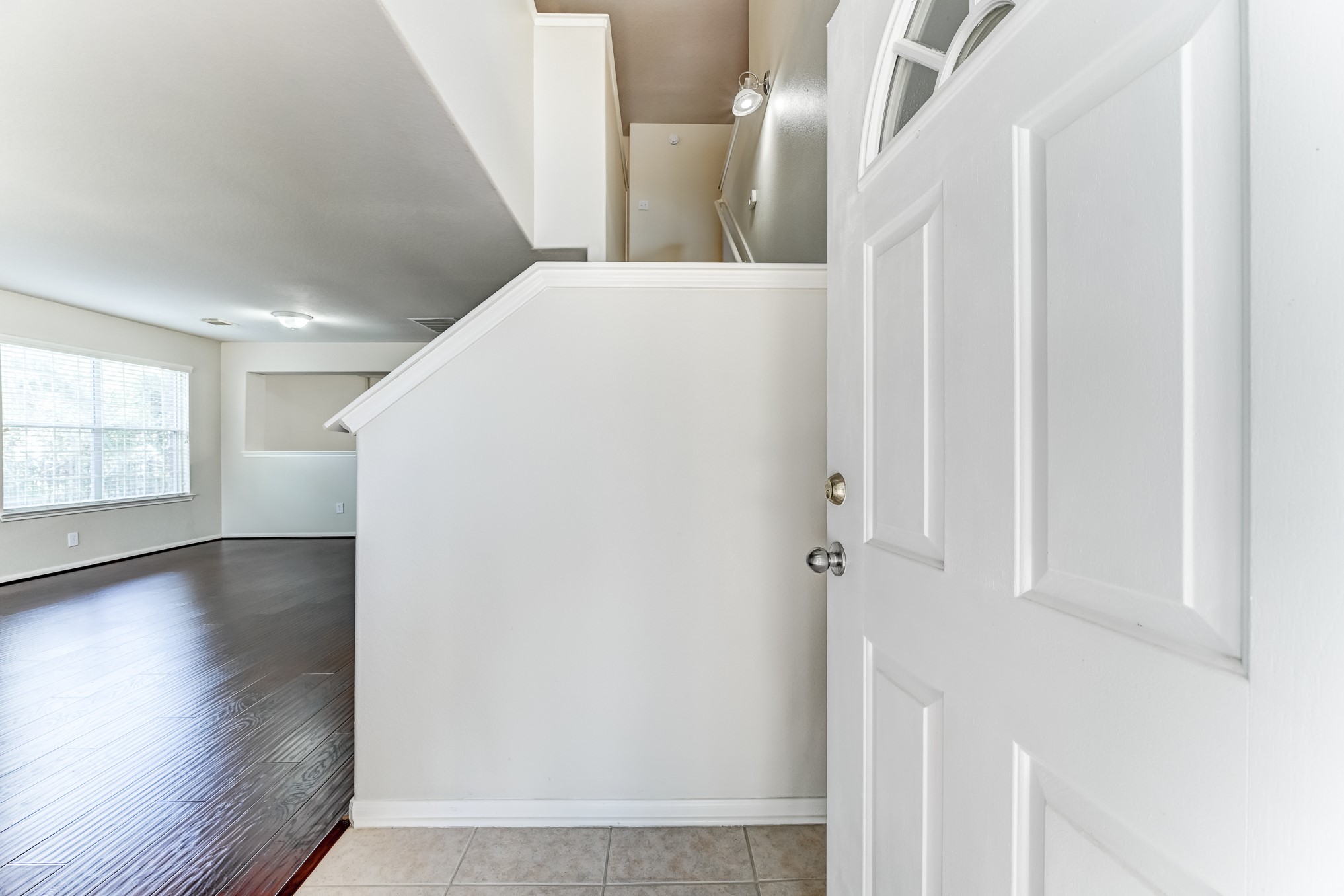 14914 Forest Enclave Lane Houston, TX 77068 - Photo 5 of 49 a view of a hallway with wooden floor and staircase