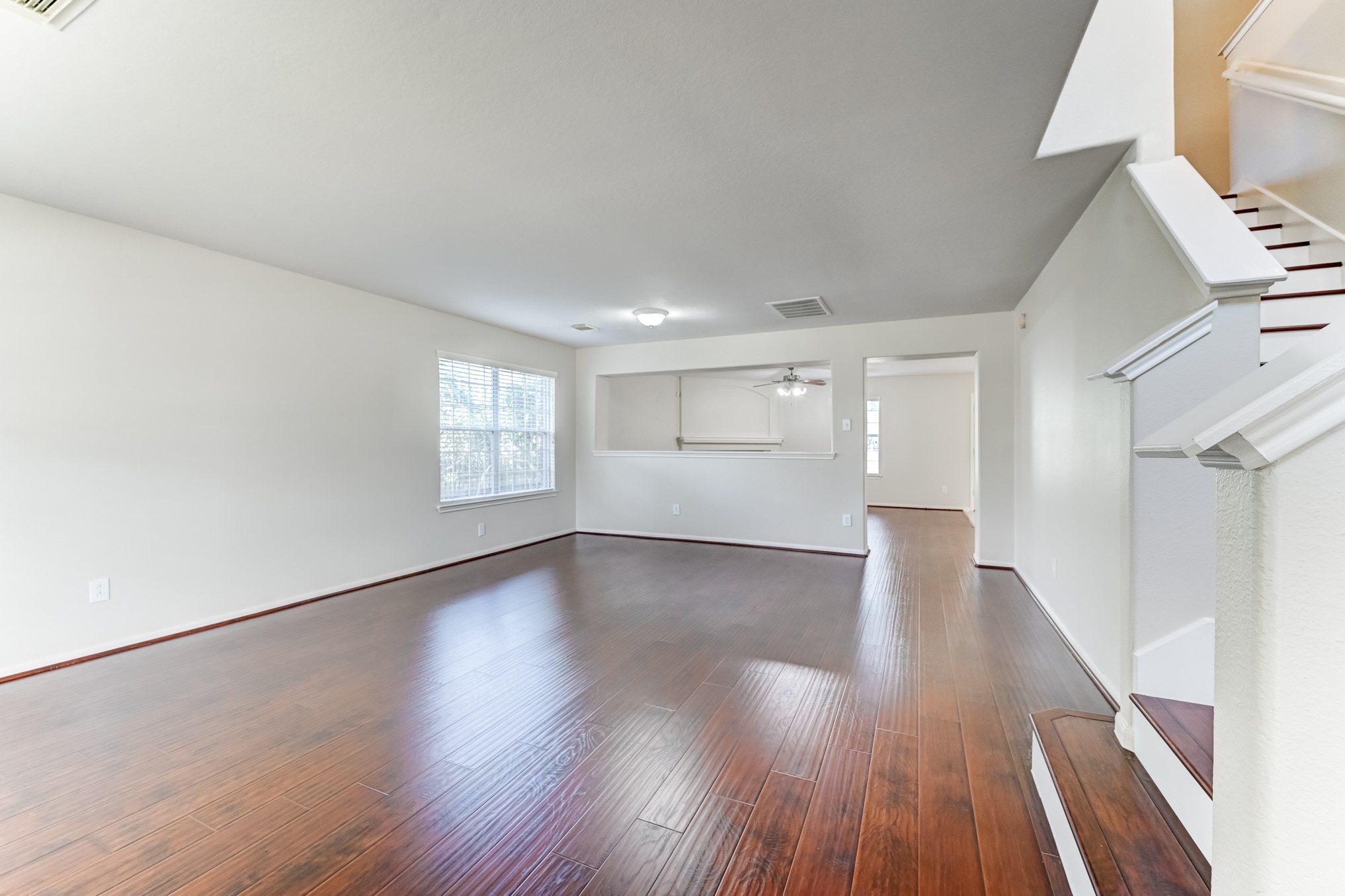 14914 Forest Enclave Lane Houston, TX 77068 - Photo 6 of 49 a view of empty room with wooden floor and fan