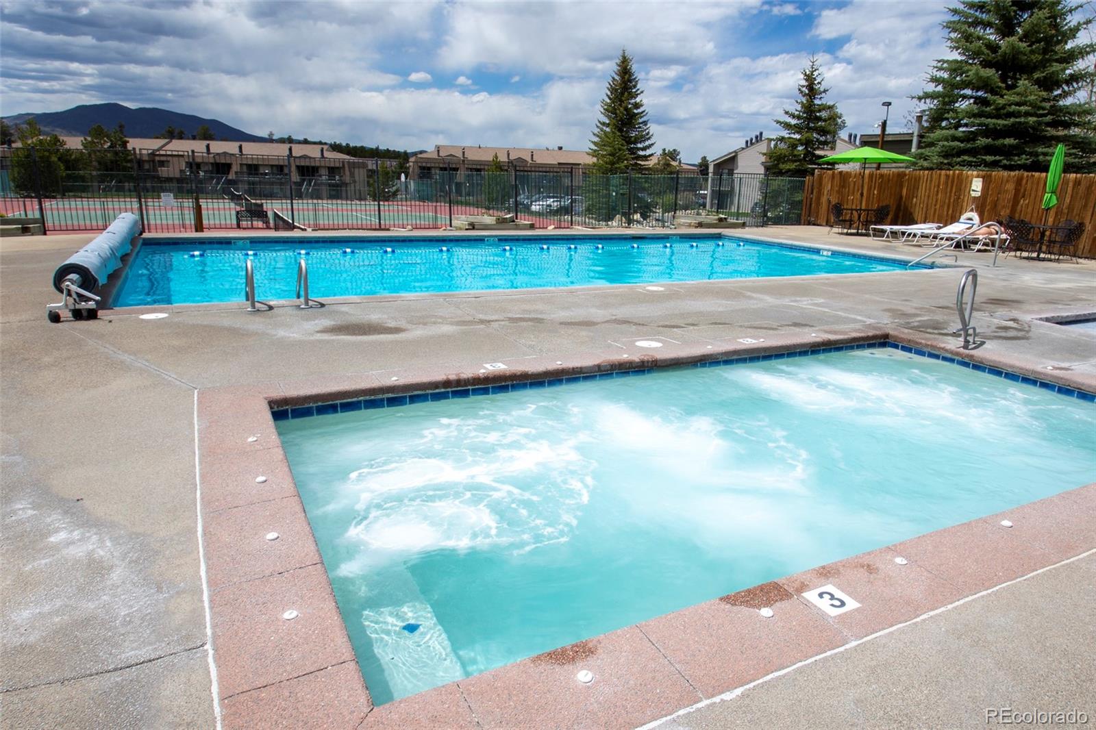 83 County Road, Unit F7 Fraser, CO 80442 - Photo 19 of 20 a view of a swimming pool with a yard