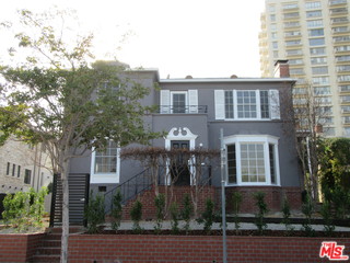 437 Shirley Place, Unit D Beverly Hills, CA 90212 - Photo 1 of 16 a front view of a house with a yard