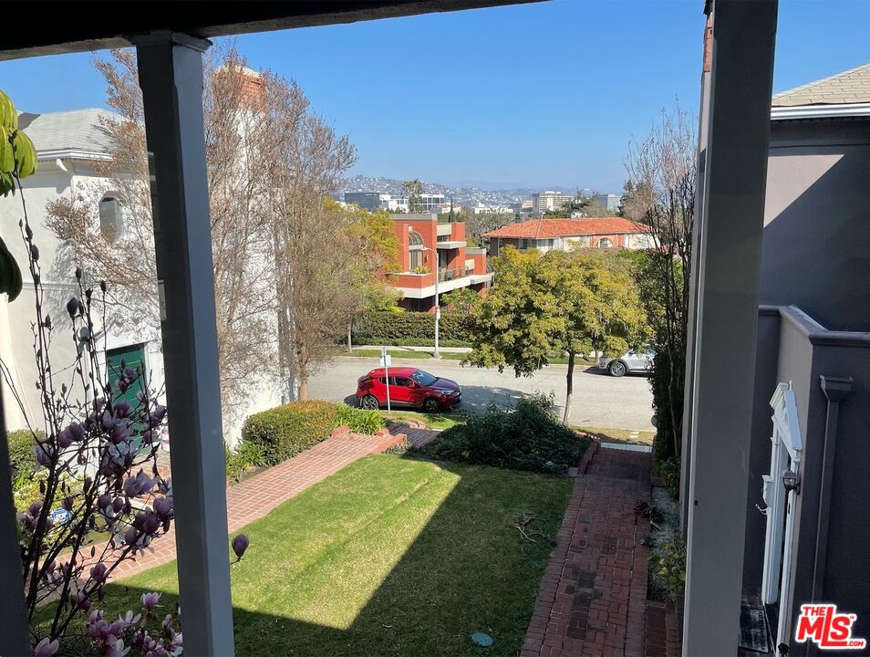 437 Shirley Place, Unit D Beverly Hills, CA 90212 - Photo 14 of 16 a view of swimming pool from a balcony