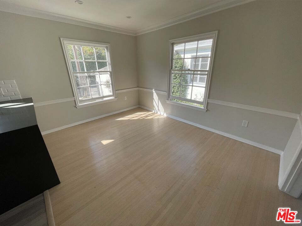 437 Shirley Place, Unit D Beverly Hills, CA 90212 - Photo 5 of 16 a view of an empty room with a window