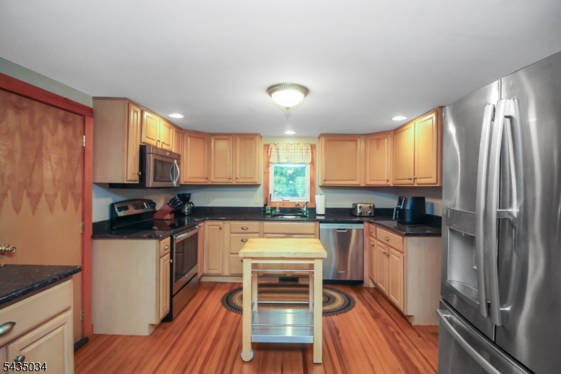 103 Petersburg Road Hackettstown, NJ 07840 - Photo 5 of 18 a kitchen with stainless steel appliances a stove sink and refrigerator