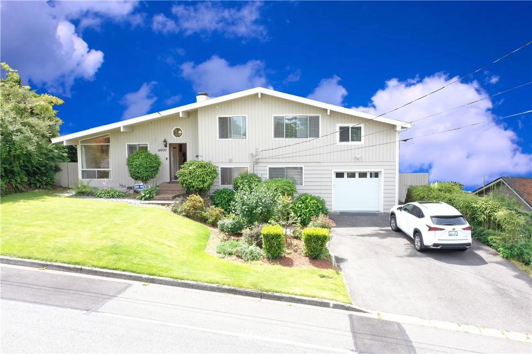 14909 Southeast 45th Place Bellevue, WA 98006 - Photo 1 of 1 a front view of a house with garden