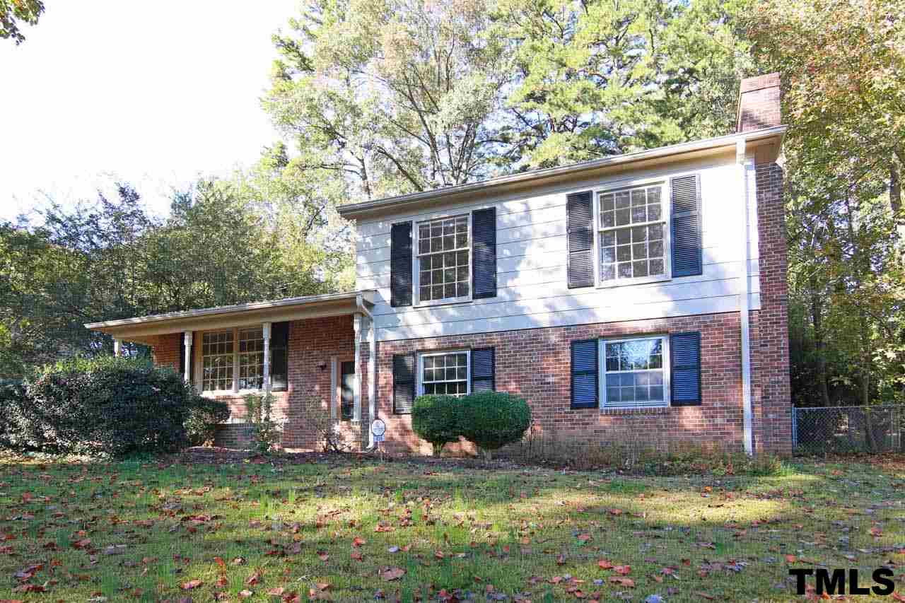 411 East Rowan Street Raleigh, NC 27609 - Photo 1 of 25 a view of a house with a yard chairs and a large tree