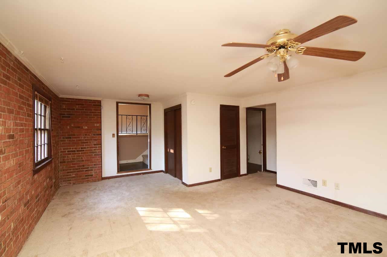 411 East Rowan Street Raleigh, NC 27609 - Photo 14 of 25 a view of an empty room with a ceiling fan