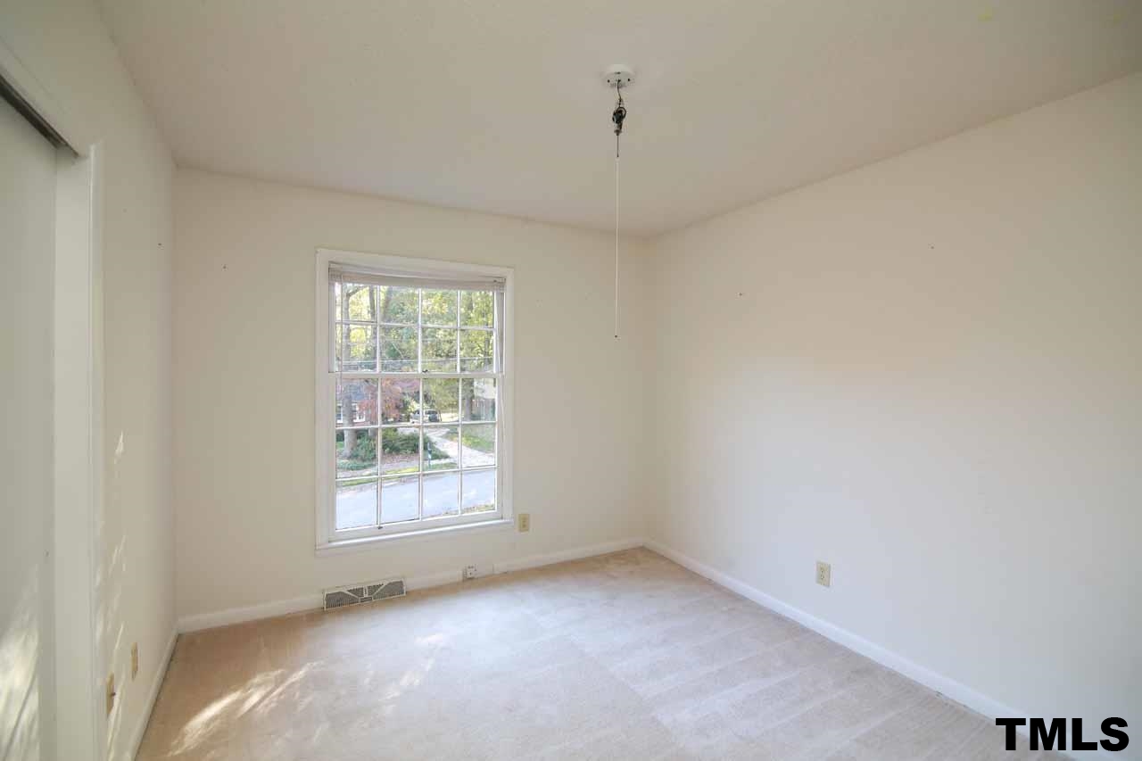 411 East Rowan Street Raleigh, NC 27609 - Photo 19 of 25 a view of an empty room with a window