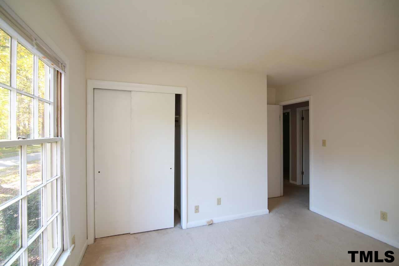 411 East Rowan Street Raleigh, NC 27609 - Photo 20 of 25 an empty room with windows