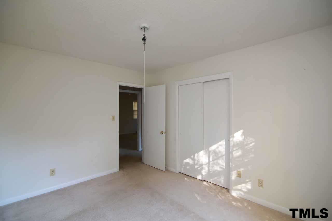 411 East Rowan Street Raleigh, NC 27609 - Photo 24 of 25 a view of an empty room and chandelier fan