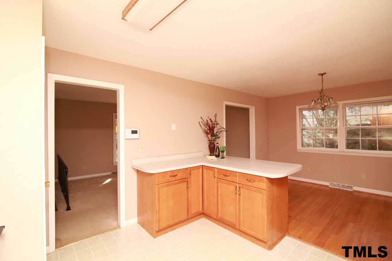 411 East Rowan Street Raleigh, NC 27609 - Photo 8 of 25 a spacious bathroom with a bathtub sink and mirror