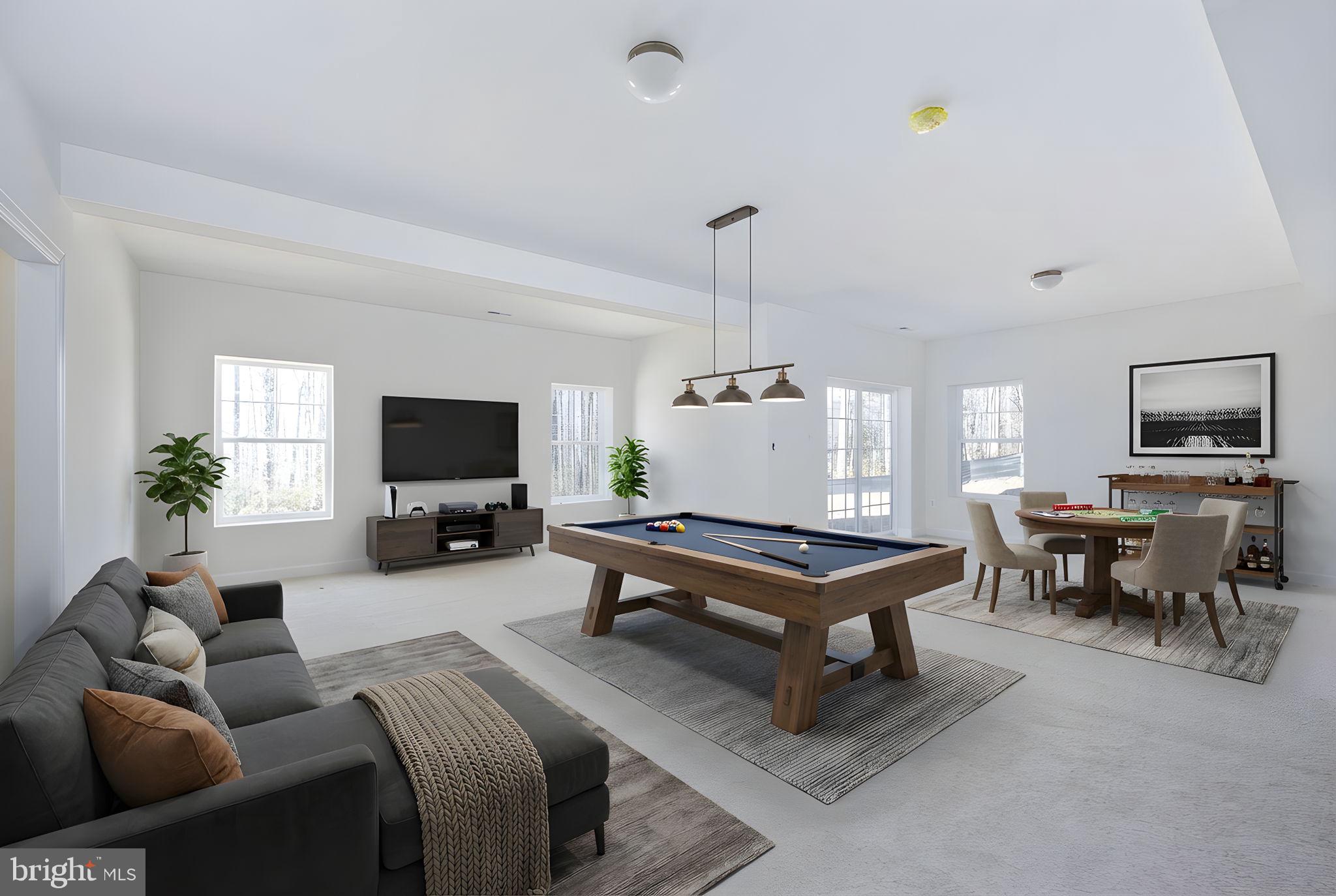 569 Tacketts Mill Road Stafford, VA 22556 - Photo 102 of 120 a living room with furniture a flat screen tv and a table