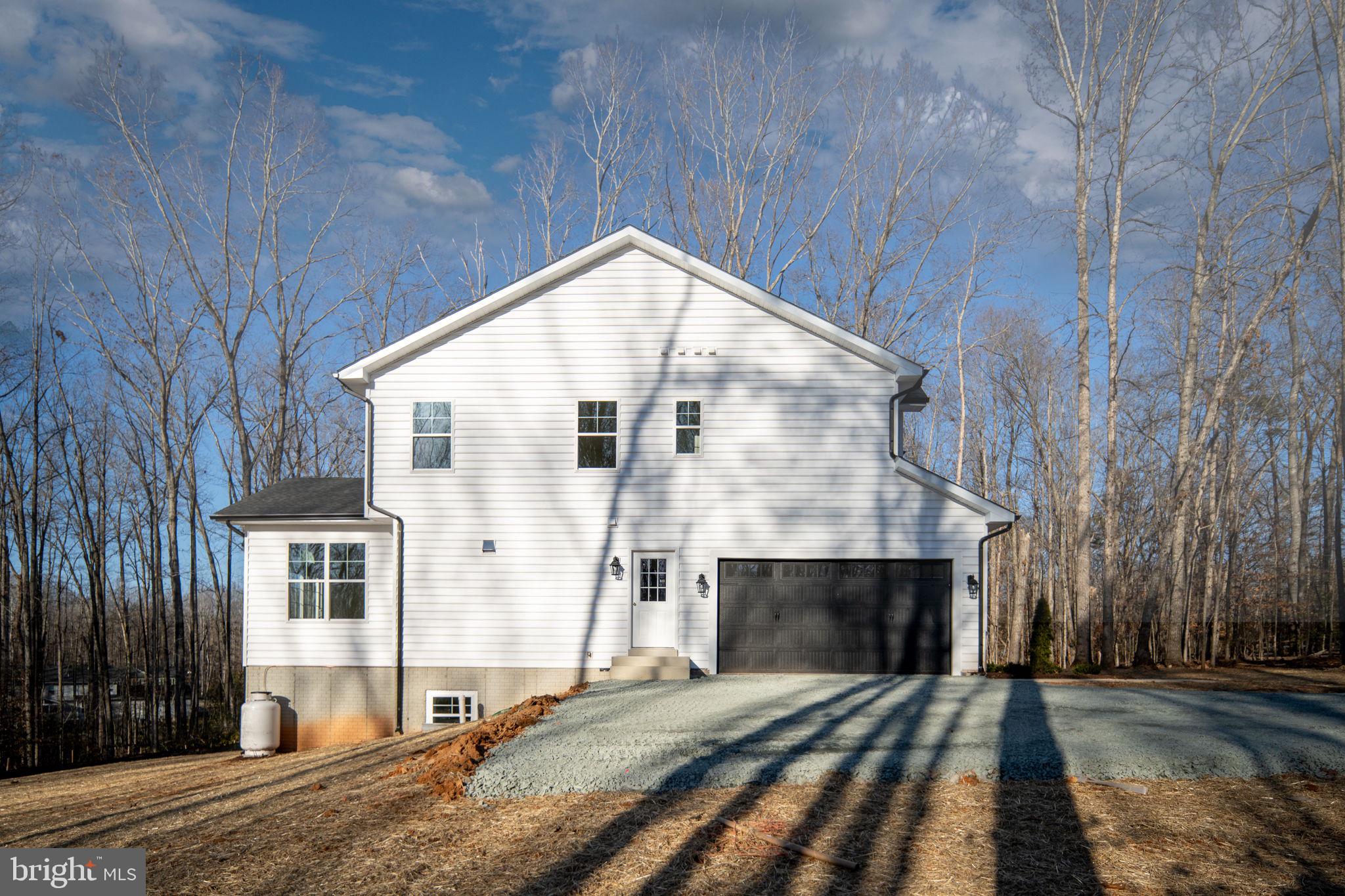 569 Tacketts Mill Road Stafford, VA 22556 - Photo 117 of 120 a front view of a house with a yard