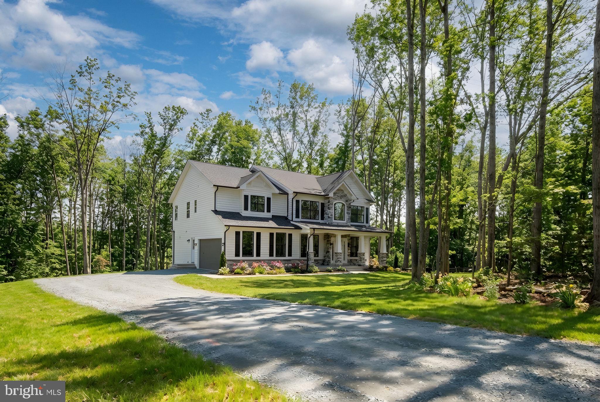 569 Tacketts Mill Road Stafford, VA 22556 - Photo 16 of 120 a view of a house with a big yard and large trees
