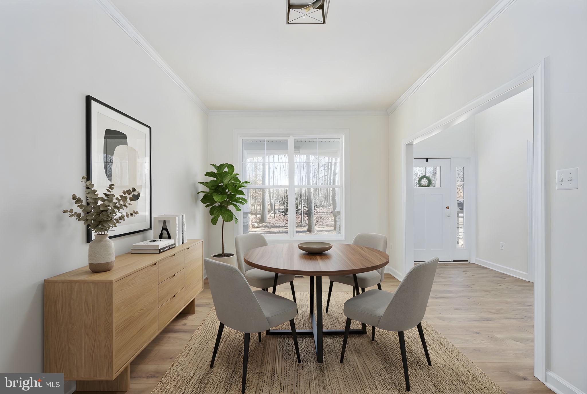 569 Tacketts Mill Road Stafford, VA 22556 - Photo 27 of 120 a dining room with furniture potted plants and wooden floor