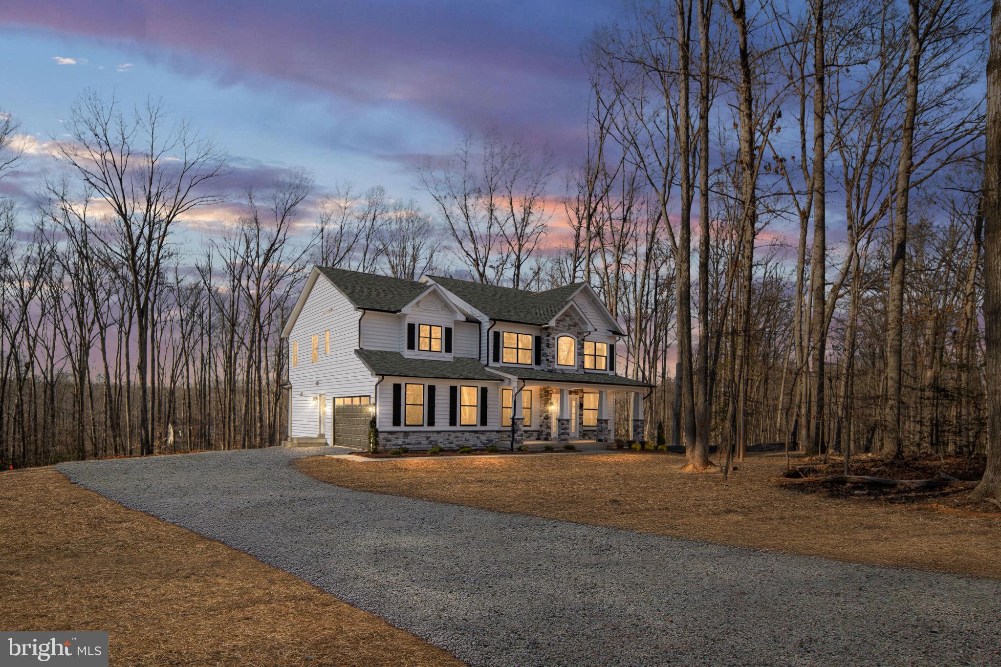 569 Tacketts Mill Road Stafford, VA 22556 - Photo 4 of 120 a front view of a house with a yard