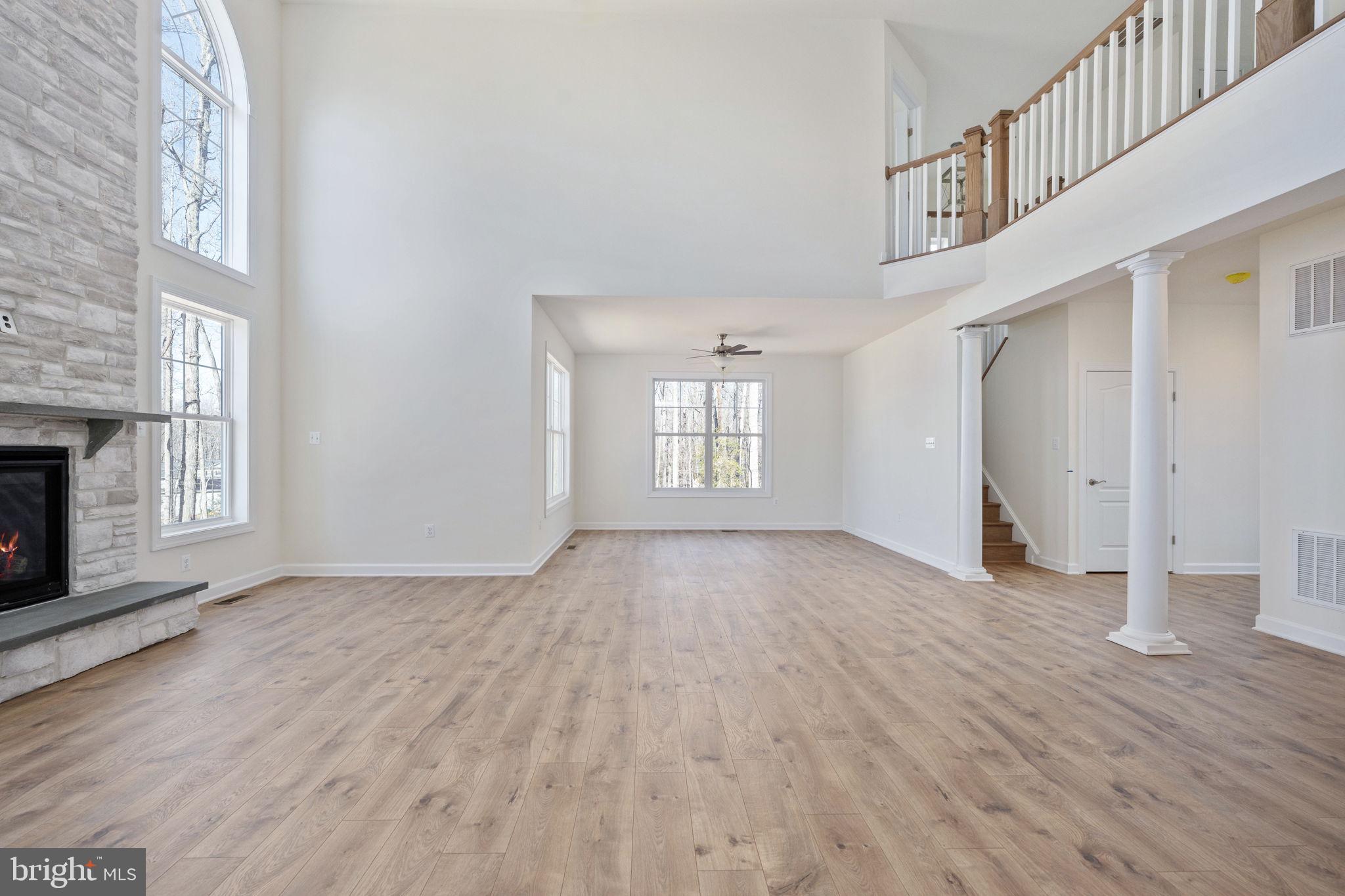 569 Tacketts Mill Road Stafford, VA 22556 - Photo 44 of 120 a view of an empty room with wooden floor and a window