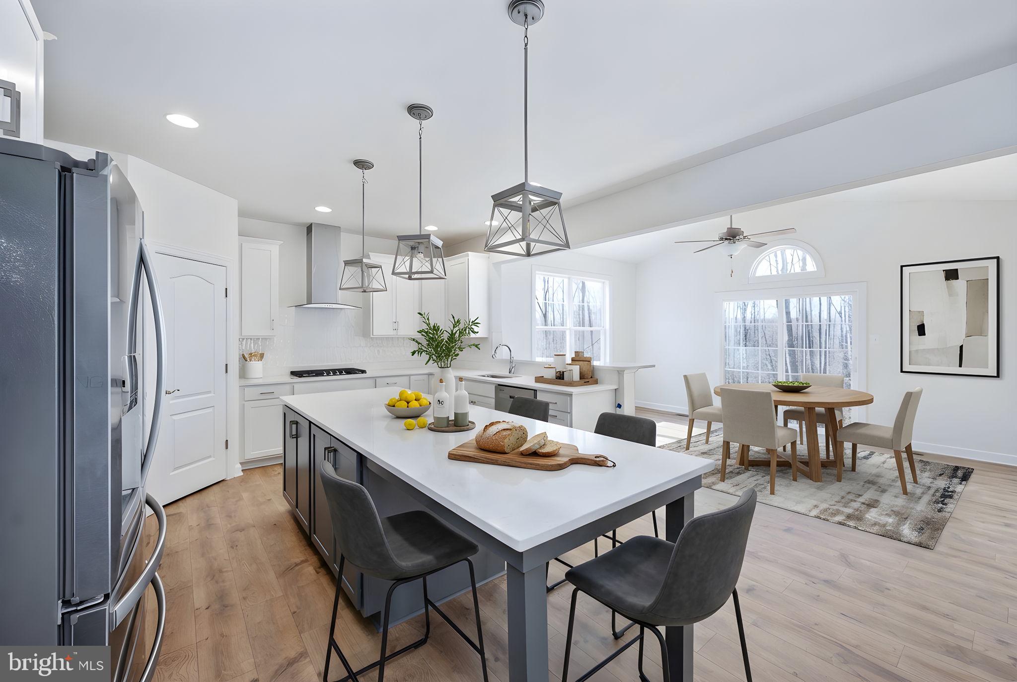 569 Tacketts Mill Road Stafford, VA 22556 - Photo 48 of 120 a view of a dining room and livingroom with furniture wooden floor a chandelier
