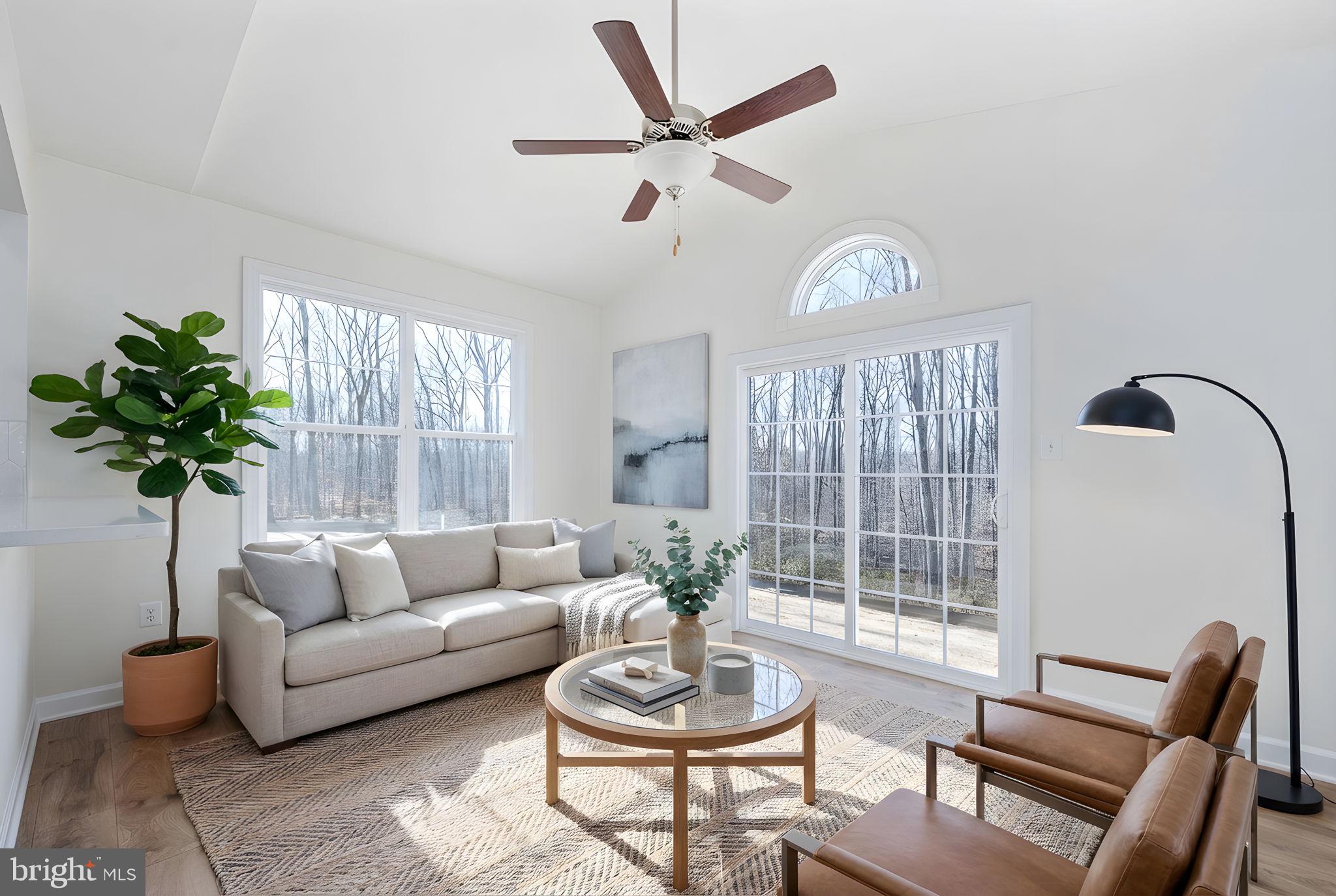 569 Tacketts Mill Road Stafford, VA 22556 - Photo 58 of 120 a living room with furniture a chandelier and a window