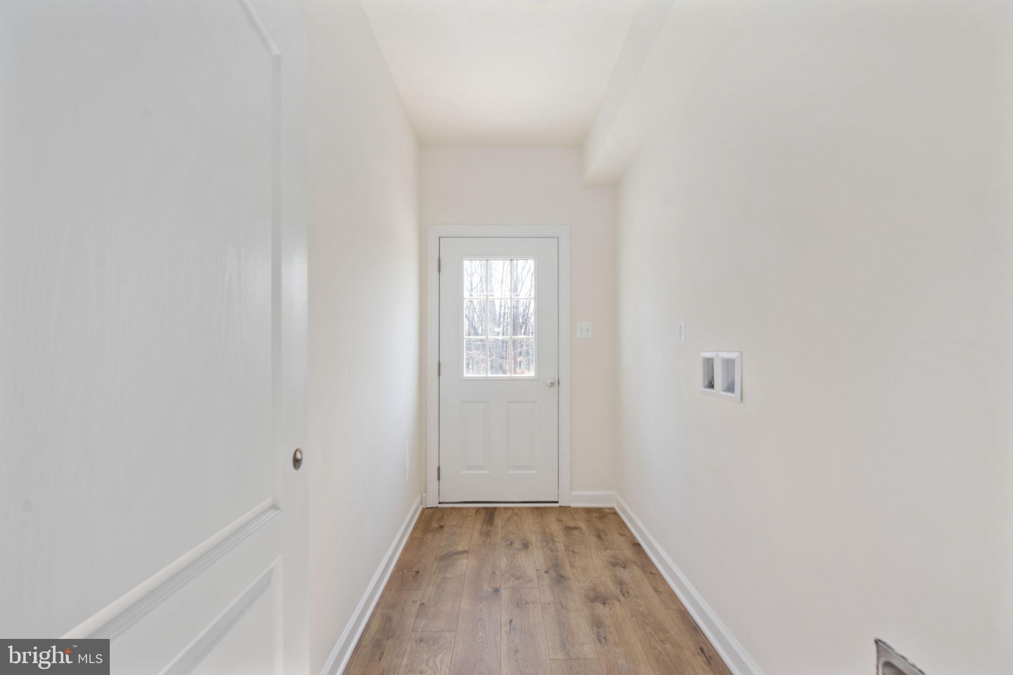 569 Tacketts Mill Road Stafford, VA 22556 - Photo 63 of 120 a view of a hallway with wooden floor