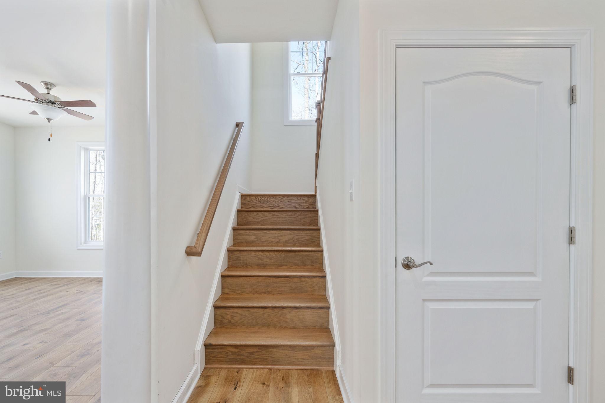 569 Tacketts Mill Road Stafford, VA 22556 - Photo 64 of 120 a view of a hallway with wooden floor and entryway