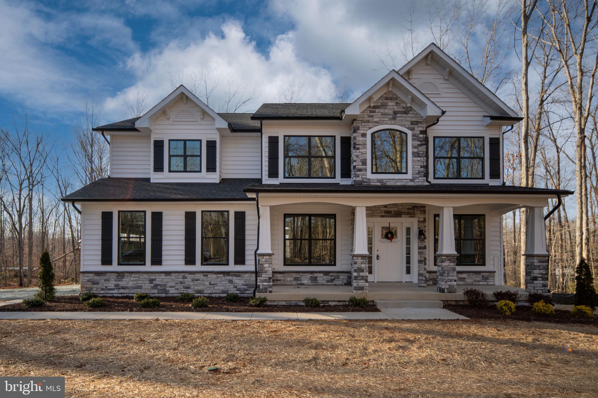 569 Tacketts Mill Road Stafford, VA 22556 - Photo 7 of 120 a front view of a house with a yard