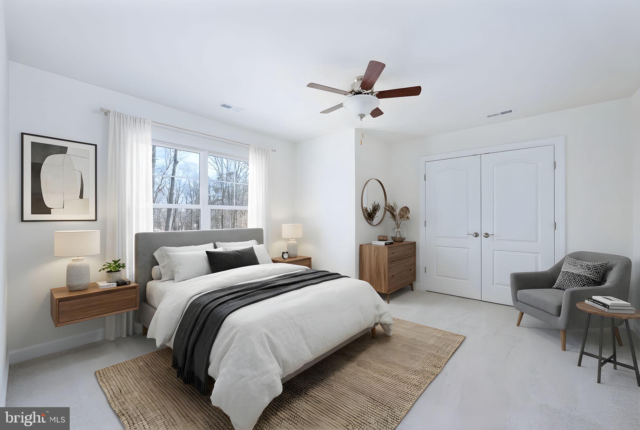 569 Tacketts Mill Road Stafford, VA 22556 - Photo 76 of 120 a bedroom with a bed a couch and a window