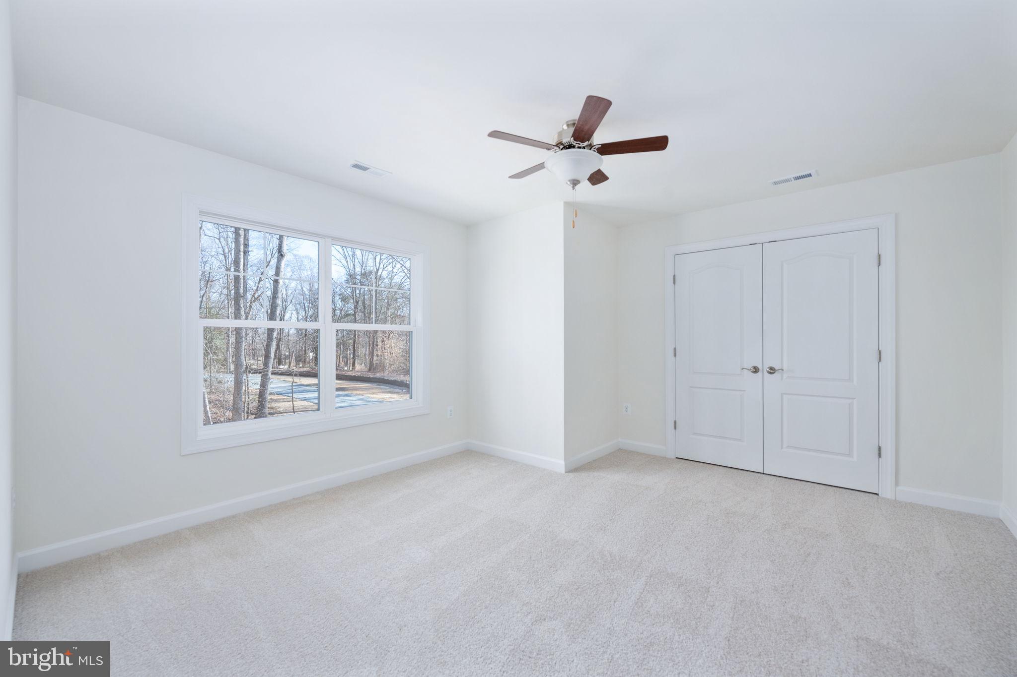 569 Tacketts Mill Road Stafford, VA 22556 - Photo 77 of 120 a view of an empty room with a window
