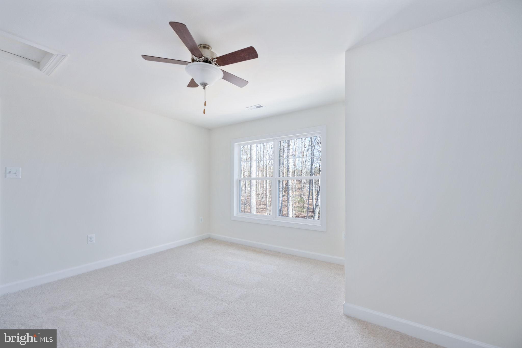 569 Tacketts Mill Road Stafford, VA 22556 - Photo 78 of 120 an empty room with ceiling fan and window