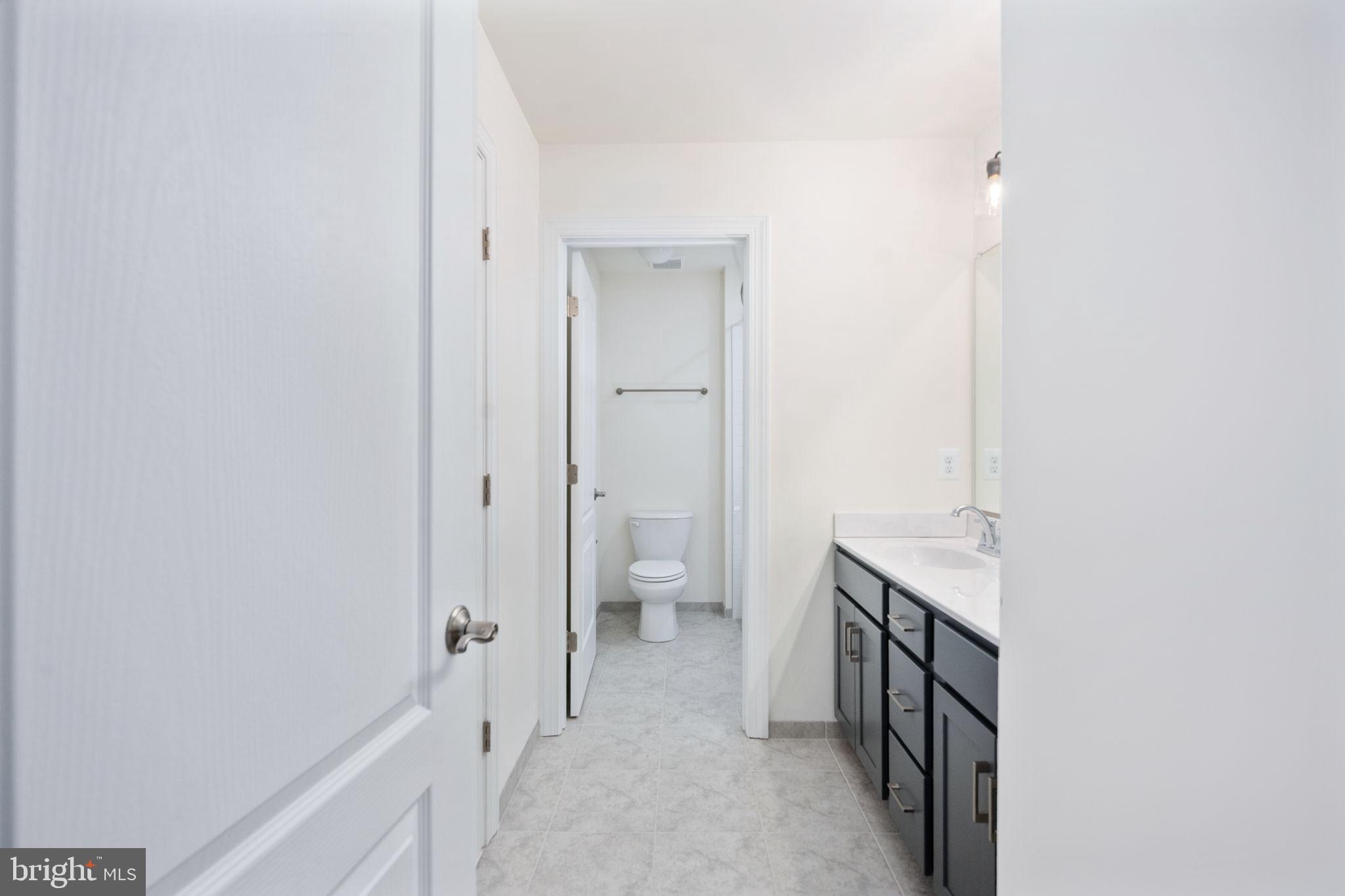 569 Tacketts Mill Road Stafford, VA 22556 - Photo 79 of 120 a view of a bathroom from a hallway