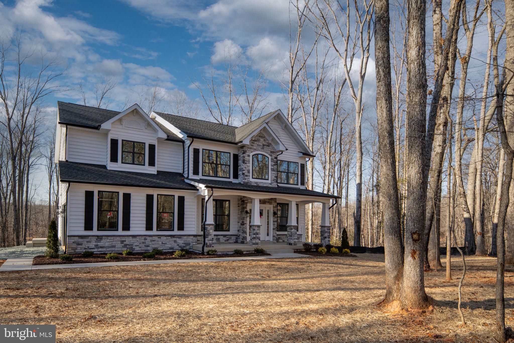 569 Tacketts Mill Road Stafford, VA 22556 - Photo 10 of 120 a front view of a house with a garden