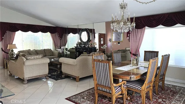 a view of a dining room with furniture and a window