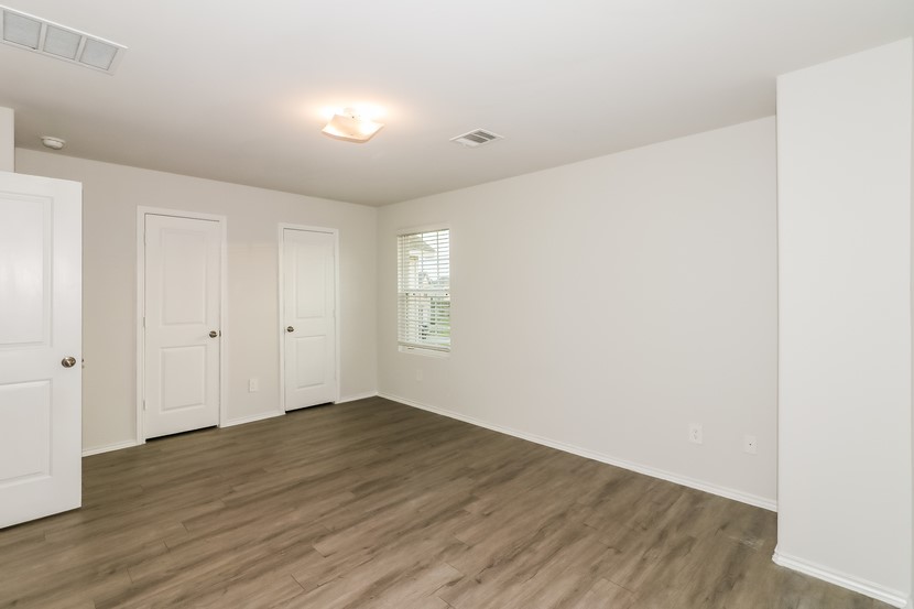 21626 Mamba Way Houston, TX 77073 - Photo 6 of 12 a view of empty room with wooden floor