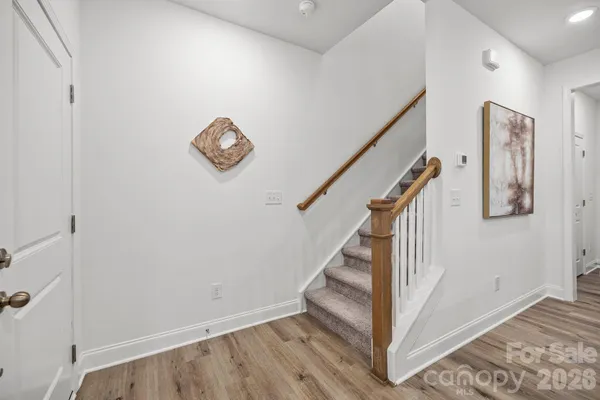 a view of entryway with wooden floor