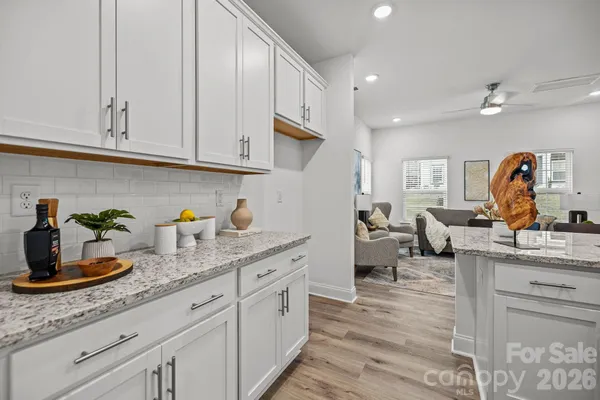 a kitchen with cabinets a sink and appliances