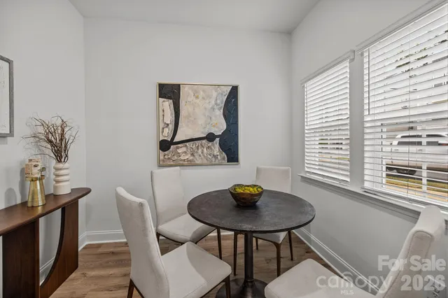 a view of a dining room with furniture and window