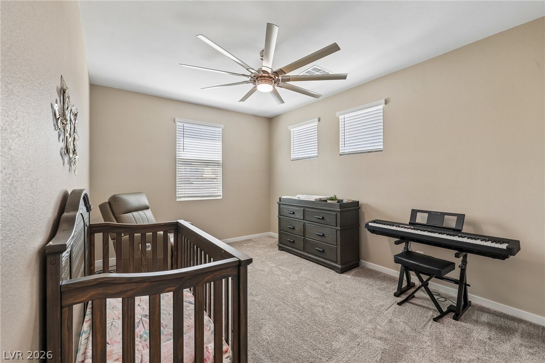 194 Viento Ridge Street Henderson, NV 89012 - Photo 38 of 72 Soft carpeting pairs with neat trim in this comfortable secondary bedroom.