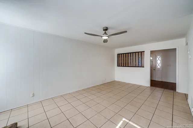 a view of an empty room and window