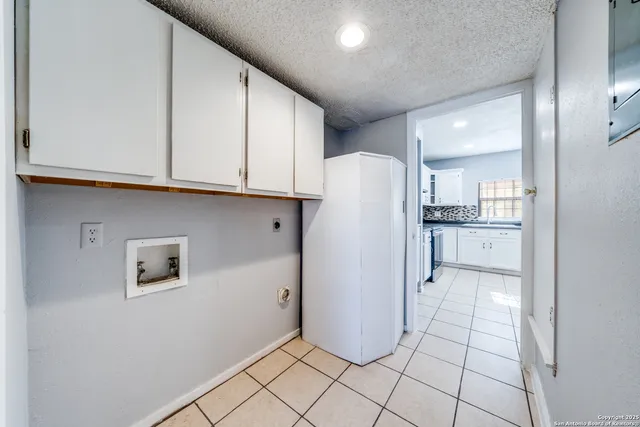 a kitchen with stainless steel appliances granite countertop a refrigerator sink and cabinets