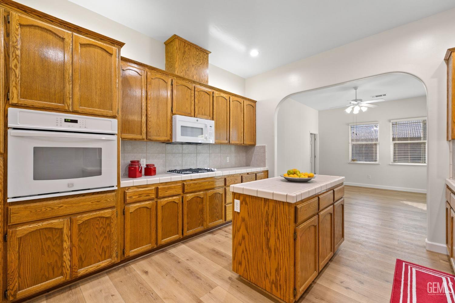 Undisclosed Address Bakersfield, CA 93313 - Photo 20 of 50 a kitchen with stainless steel appliances granite countertop a stove and a sink