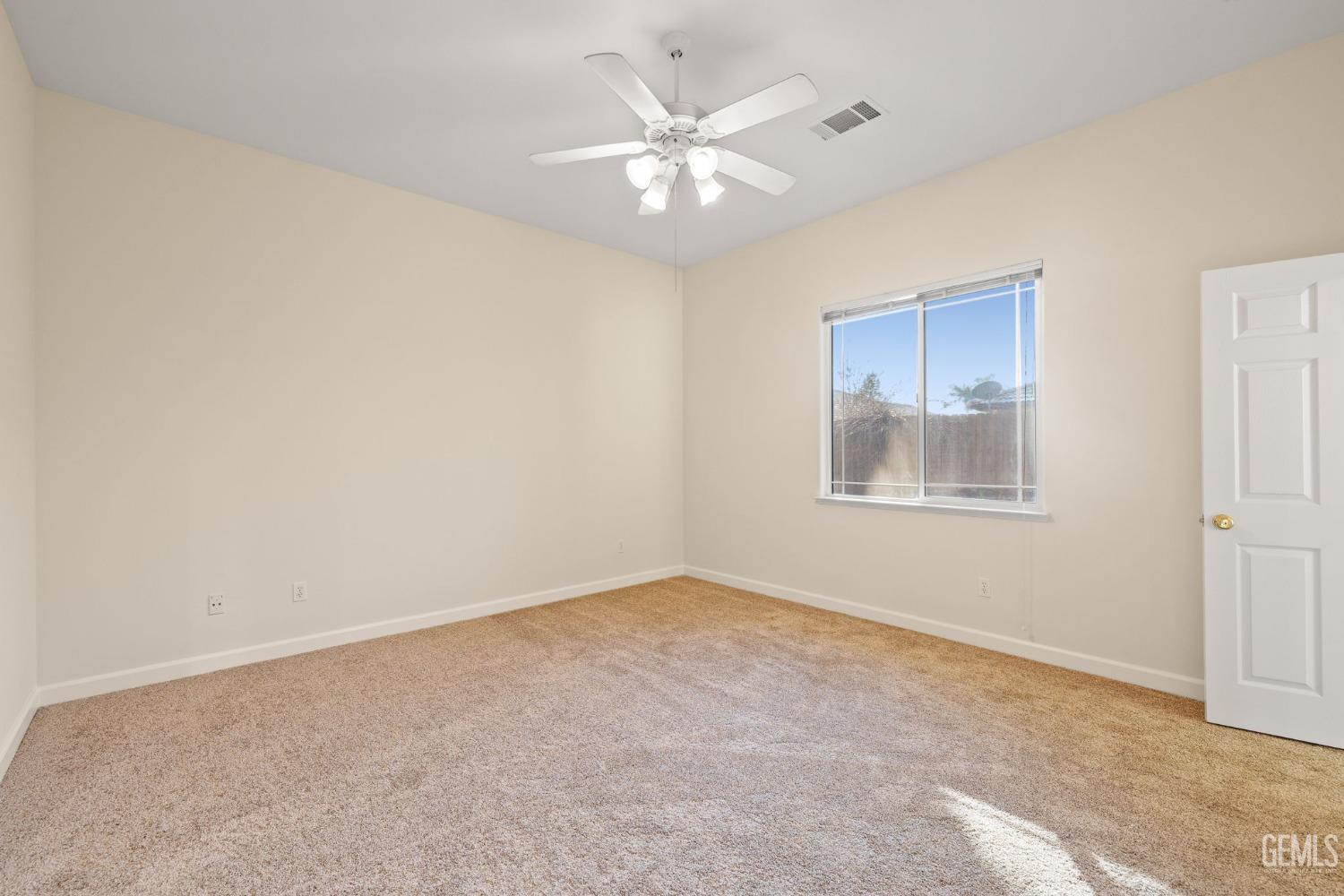 Undisclosed Address Bakersfield, CA 93313 - Photo 25 of 50 a view of an empty room with a window