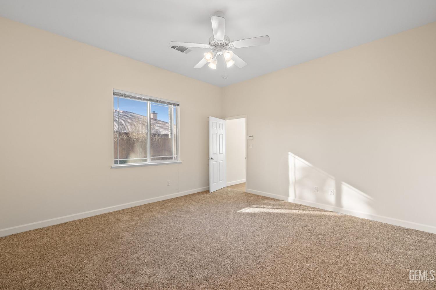 Undisclosed Address Bakersfield, CA 93313 - Photo 26 of 50 a view of an empty room with a window