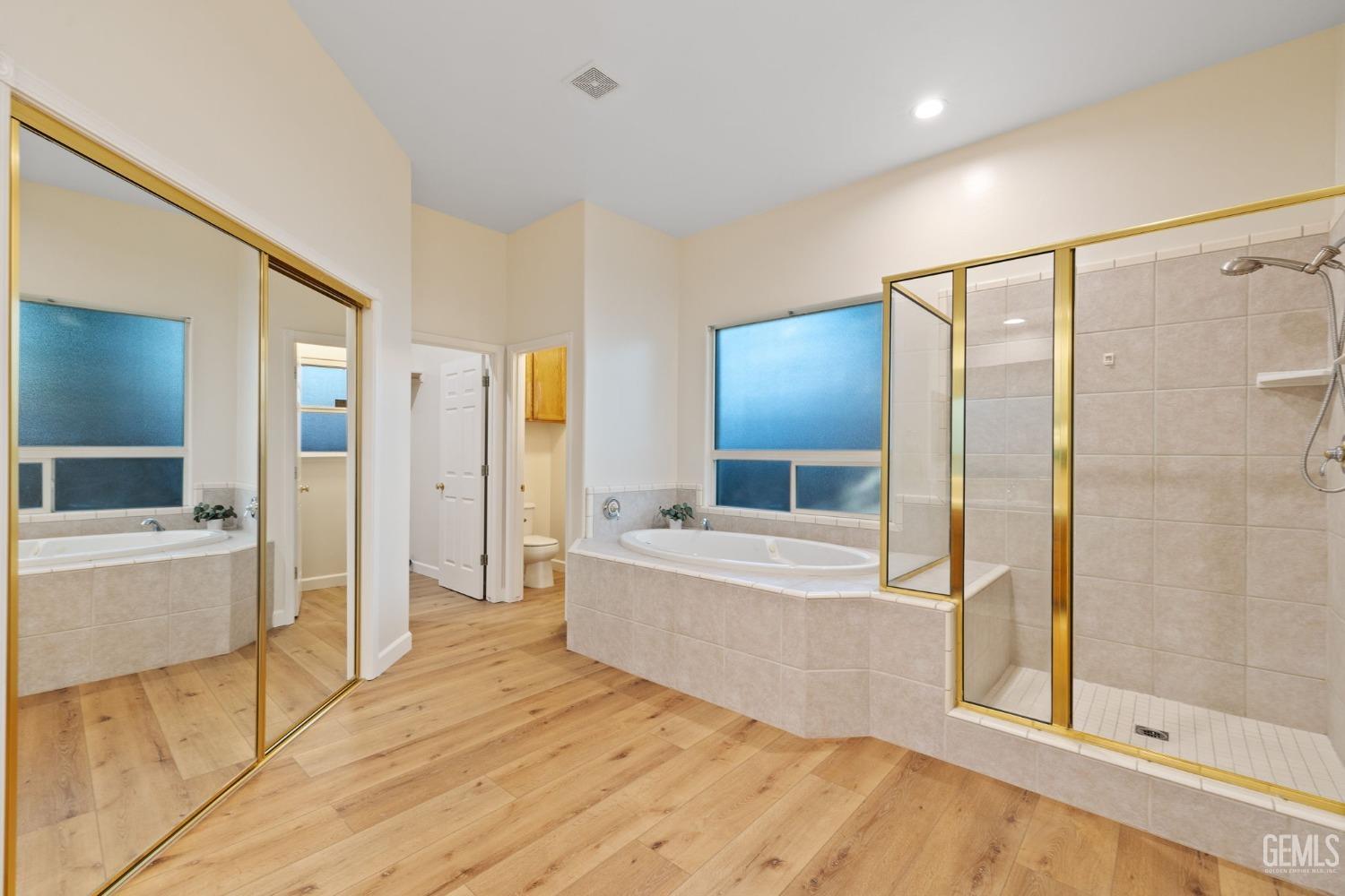 Undisclosed Address Bakersfield, CA 93313 - Photo 29 of 50 a large spacious bathroom with a large tub and shower