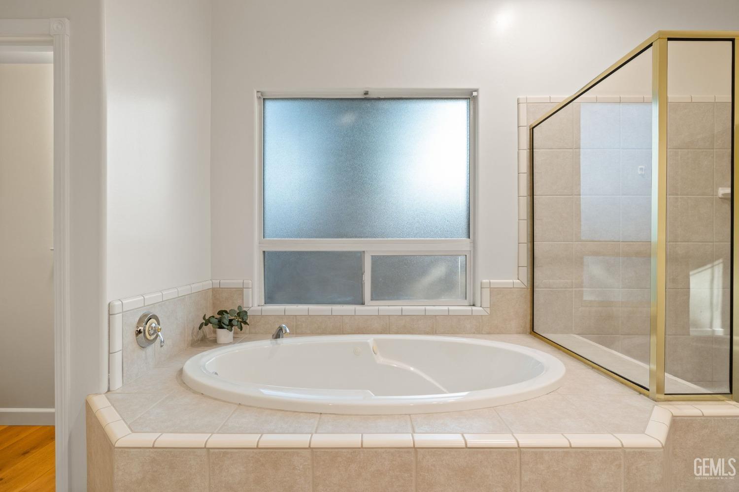 Undisclosed Address Bakersfield, CA 93313 - Photo 30 of 50 a white bath tub sitting next to a shower