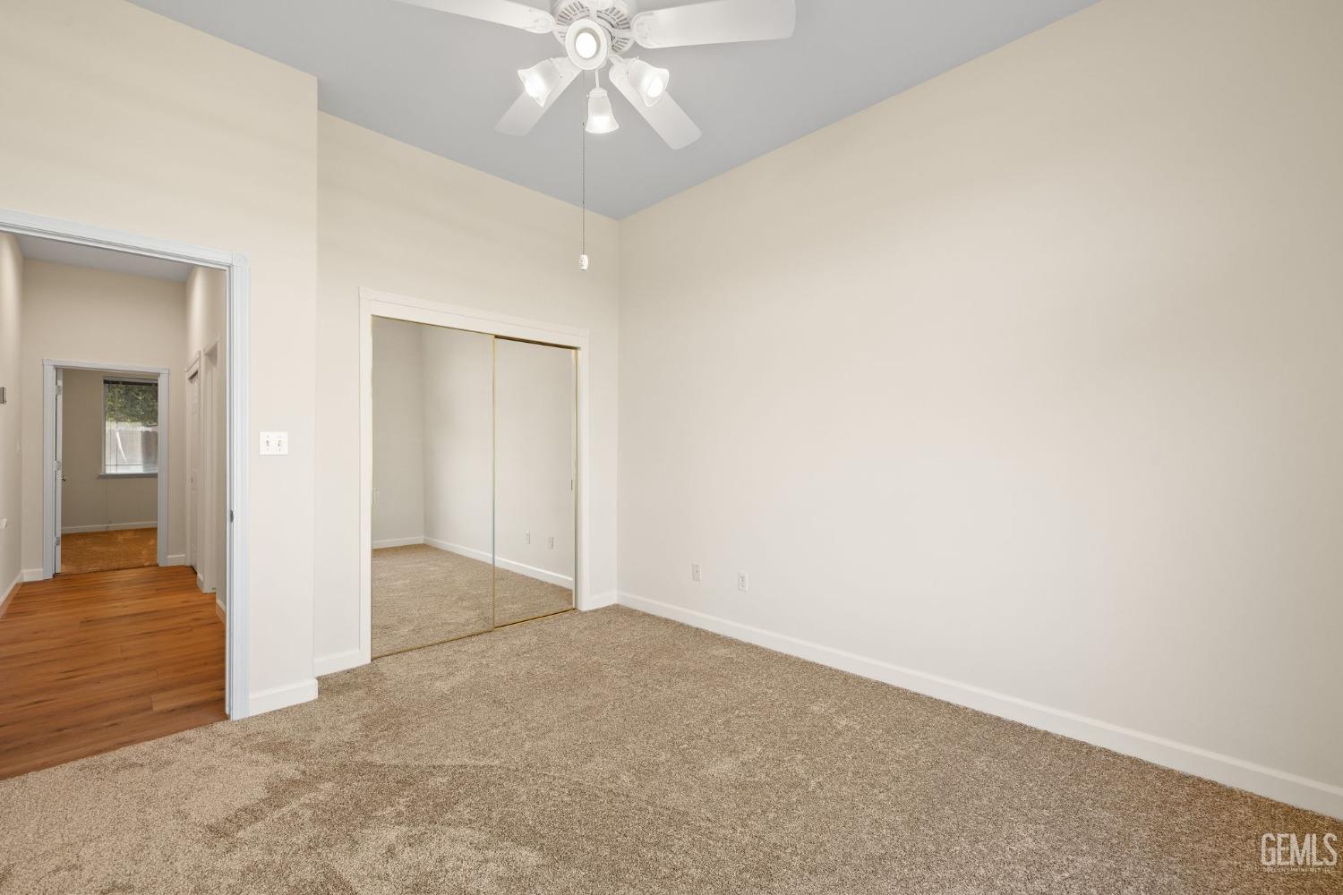 Undisclosed Address Bakersfield, CA 93313 - Photo 37 of 50 an empty room with fan and hallway